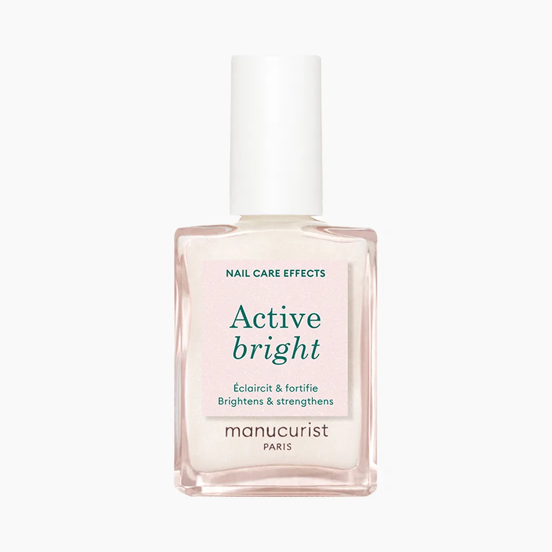 Lahvička pečujícího laku Active Bright na světlém pozadí