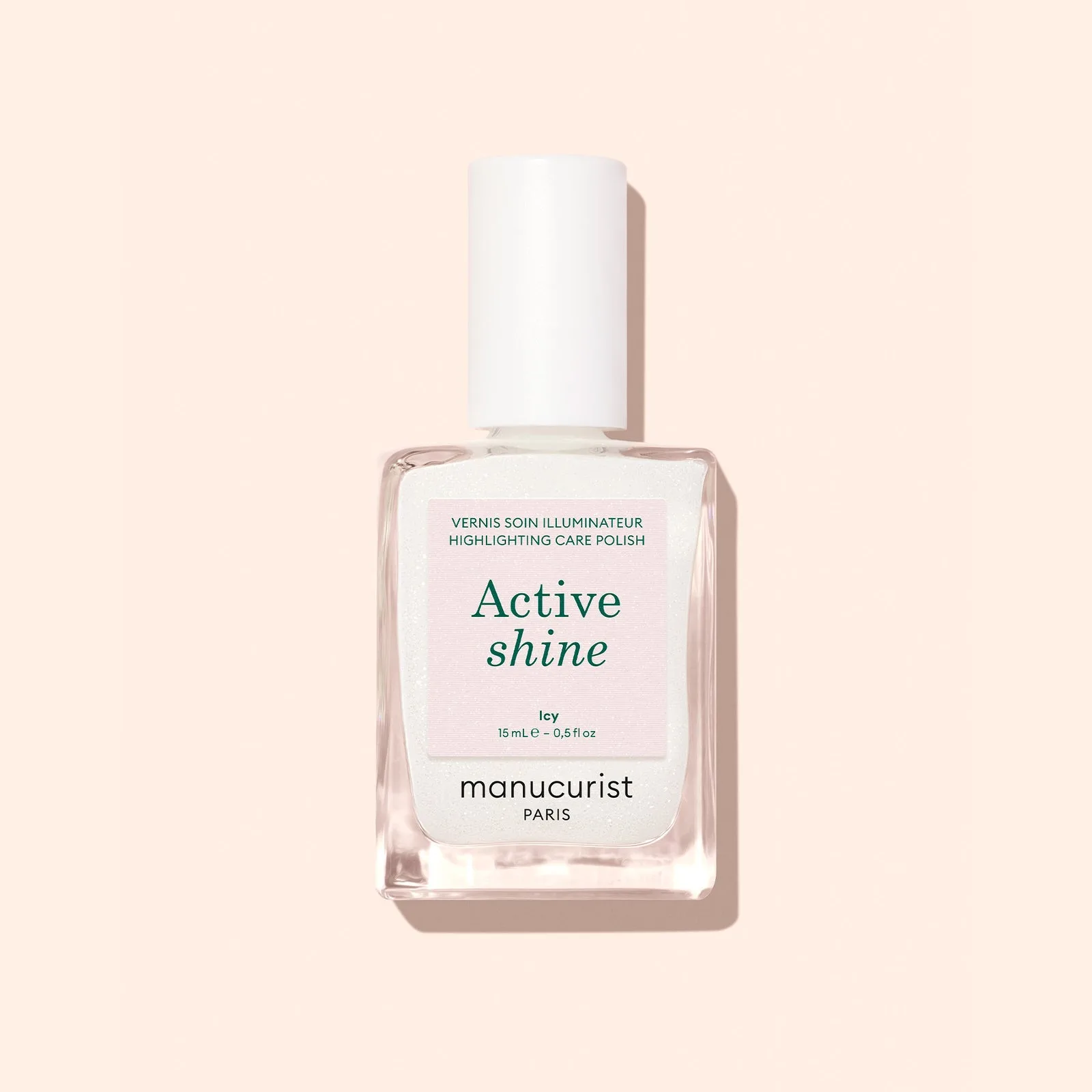 Lahvička pečujícího laku Active Shine Icy na světlém pozadí