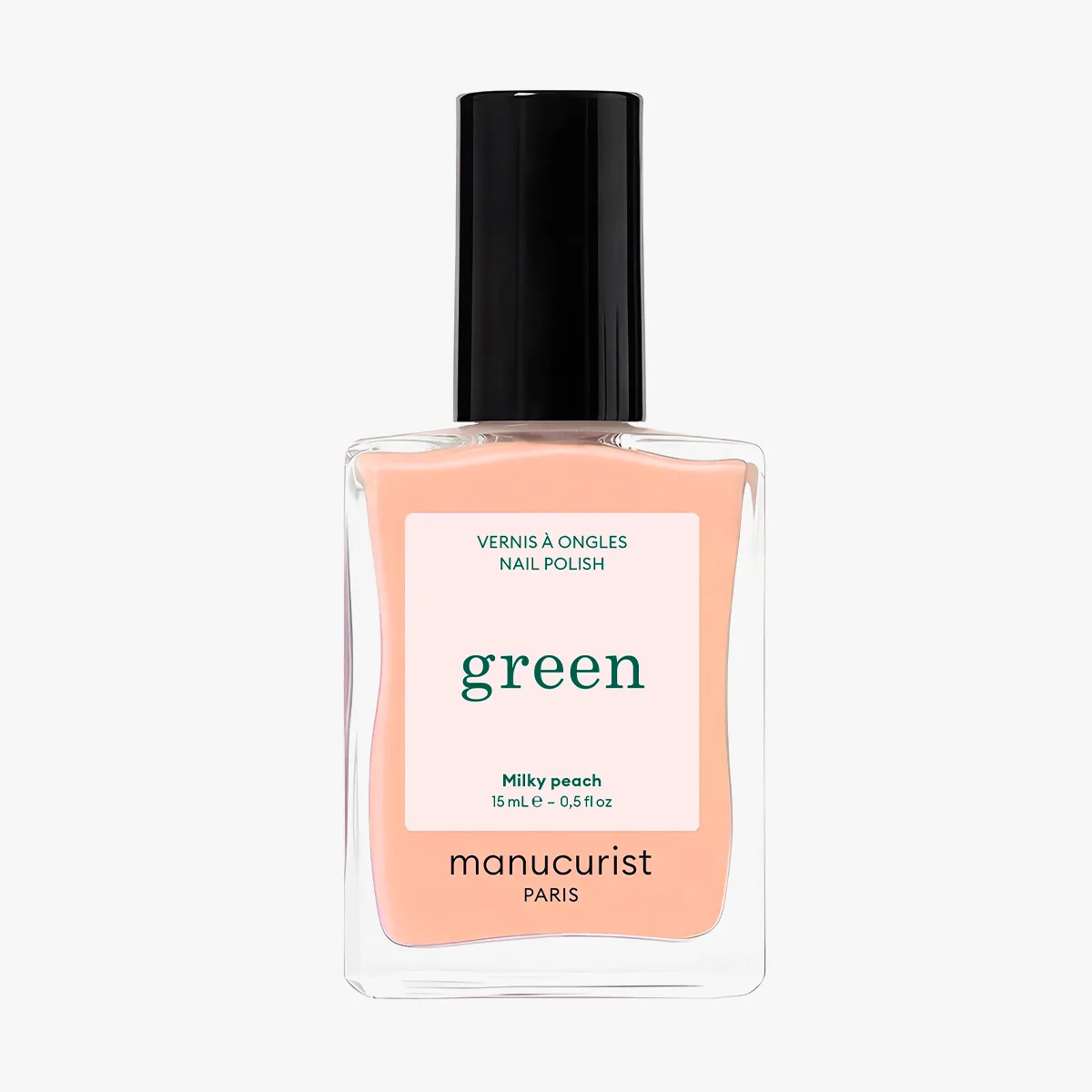 Lahvička Green Milky Peach na světlém pozadí